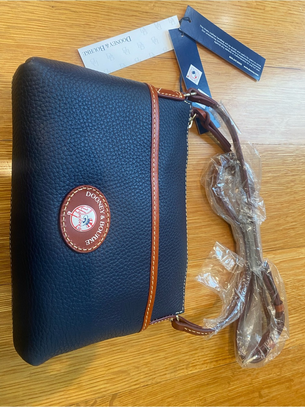 Dooney & Bourke Black Pebbled Leather Crossbody with Brown Trim